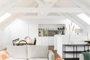 a living room with a white couch and a table at The Millbrook Inn in Kingsbridge