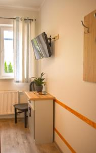 Televízia a/alebo spoločenská miestnosť v ubytovaní Arcus Premium Hostel