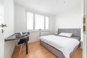 A bed or beds in a room at AR Rezidencia Ludmanská