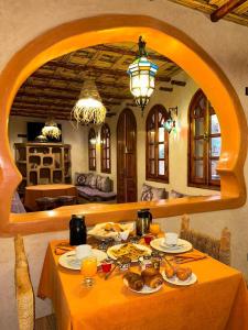 a table with food on it in a room at RIAD AMNAY in Taroudant