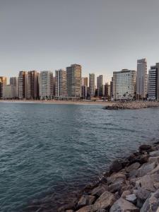 a view of a city from a body of water at APARTAMENTO BEACH in Fortaleza