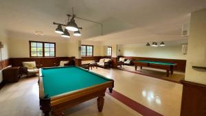 a large room with a pool table in it at Hotel y Cabañas Huallilemu Sur - Caja Los Andes in El Quisco