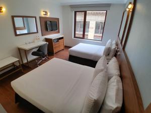 Postel nebo postele na pokoji v ubytování Hotel Ritz Ciudad de México