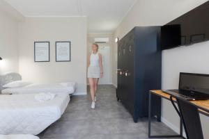 Televisyen dan/atau pusat hiburan di Piccolo Catalunya Hostel
