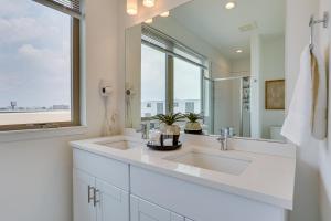 a bathroom with a sink and a large mirror at 3 Mi to Center City Philadelphia Townhome in Philadelphia +28 photos