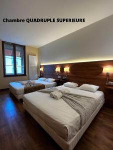 Hôtel Terminus - Pizzeria Pizz'a gogo - salle de sport - face à la gare客房内的一张或多张床位