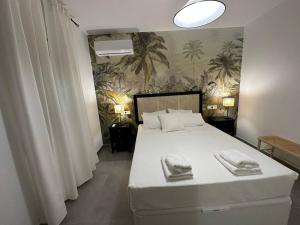 Ένα ή περισσότερα κρεβάτια σε δωμάτιο στο El Sabil de la Mezquita