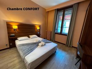 Hôtel Terminus - Pizzeria Pizz'a gogo - salle de sport - face à la gare客房内的一张或多张床位