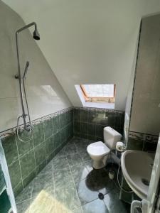 a bathroom with a shower and a toilet and a sink at Apartment Happy Holiday 2 in Burgas City