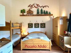 Posteľ alebo postele v izbe v ubytovaní Piccolo Nido Falcade