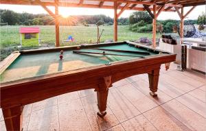 a pool table sitting on top of a patio at Amazing Home In Stare Sady With Outdoor Swimming Pool in Stare Sady