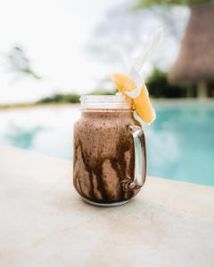 a mason jar filled with chocolate peanut butter shake at Mellow Resort in Gemastepe