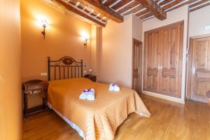 Postel nebo postele na pokoji v ubytování Hotel Rincón Castellano