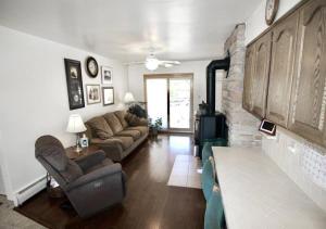 a living room with a couch and a fireplace at Horsehead Haven in Monticello in Monticello
