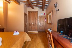 TV a/nebo společenská místnost v ubytování Hotel Rincón Castellano