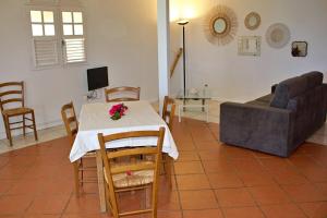 a living room with a table and a couch at Domaine Macabou in Le Vauclin