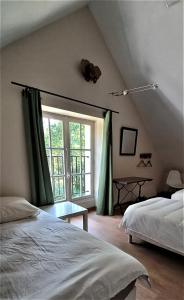 Cama o camas de una habitación en Gîte-Région centre-Sologne 41 proche Lamotte Beuvron