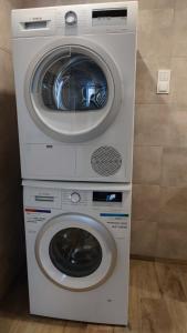 a washer and dryer stacked on top of each other at Stare Miasto in Kłodzko +3 photos