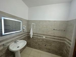 a bathroom with a sink and a mirror at Rus Villa in Berat