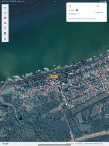 an aerial view of a beach and the water at Villa Gardenia Ureki in Ureki