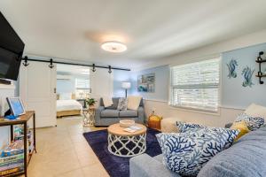 a living room with a couch and a table at 2 Mi to Bradenton Beach Water-View Home with BBQ in Bradenton