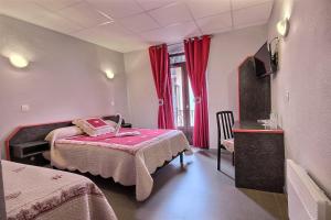 a bedroom with two beds and a window with red curtains at Hotel Central in Saint-Pierre-dʼAlbigny