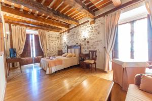 Postel nebo postele na pokoji v ubytování Hotel Rincón Castellano