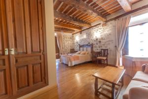 Postel nebo postele na pokoji v ubytování Hotel Rincón Castellano