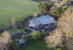 an aerial view of a house with a train at Beautiful garden apartment with private patio and garden view in Dublin