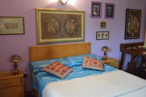 En eller flere senge i et værelse på La Casa di Gianna