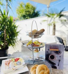 a table with a tray of breakfast food on it at Ferien-Wohnung für 1-4 Pers in Seenähe in Timelkam