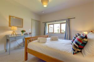 Postel nebo postele na pokoji v ubytování Wash House, Rookery Farm