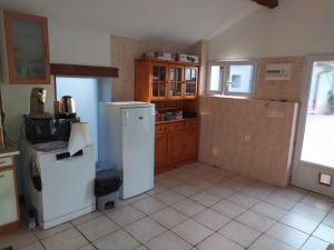 a kitchen with two refrigerators in a room at Chez Marmotte in Creuzier-le-Neuf