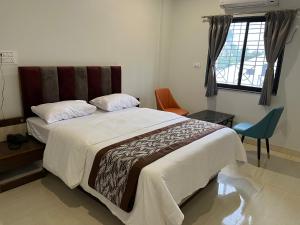 Postel nebo postele na pokoji v ubytování Hotel Jeet Paradise