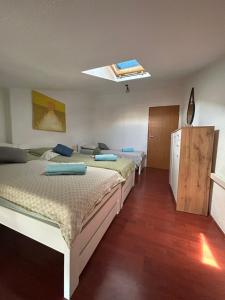 a room with two beds in a room at Rijeka city center apartment in Rijeka