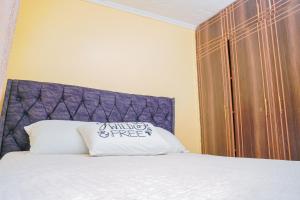 מיטה או מיטות בחדר ב-Entire Fully furnished Villas in Kisii