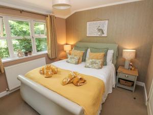 Postel nebo postele na pokoji v ubytování 1 Hornbeam Lodge