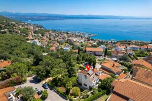 an aerial view of a city and the water at Villa The Nest in Opatija