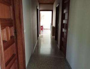 a hallway with a door and a room with a hallwayngthngthngthngthngth at Habitació V Cal Kim in Martorell