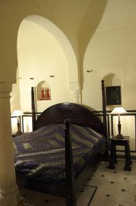 Posteľ alebo postele v izbe v ubytovaní Hotel Chobdar Haveli