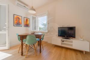 TV a/nebo společenská místnost v ubytování A Casa di Massi - Goelba