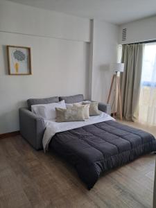 Ένα ή περισσότερα κρεβάτια σε δωμάτιο στο Departamento La Restinga - La Perla