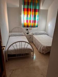 Postelja oz. postelje v sobi nastanitve Duplex en el Centro de Huelva