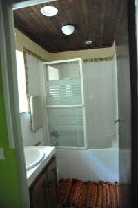 a bathroom with a tub and a sink and a shower at Marilune in Coux-et-Bigaroque