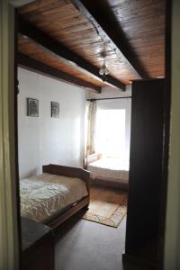 a bedroom with a bed and a window at Marilune in Coux-et-Bigaroque