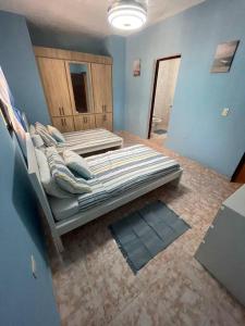 a bedroom with two beds in a room at Casa Francesca in Boca Chica