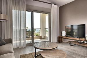 TV a/nebo společenská místnost v ubytování Cocoon Elegant Living