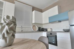 Kuchyň nebo kuchyňský kout v ubytování Cocoon Elegant Living