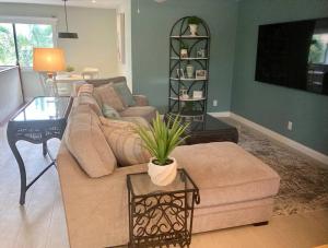 a living room with a couch and a table at Stylish & Cheerful Marco Home w/ Awesome Location in Marco Island