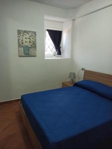 Posteľ alebo postele v izbe v ubytovaní A due passi dal castello